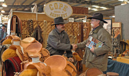 Ryan greets George Kline at the Cope Saddlery booth in Red Bluff, California at the annual Bull and Gelding Sale trade show.